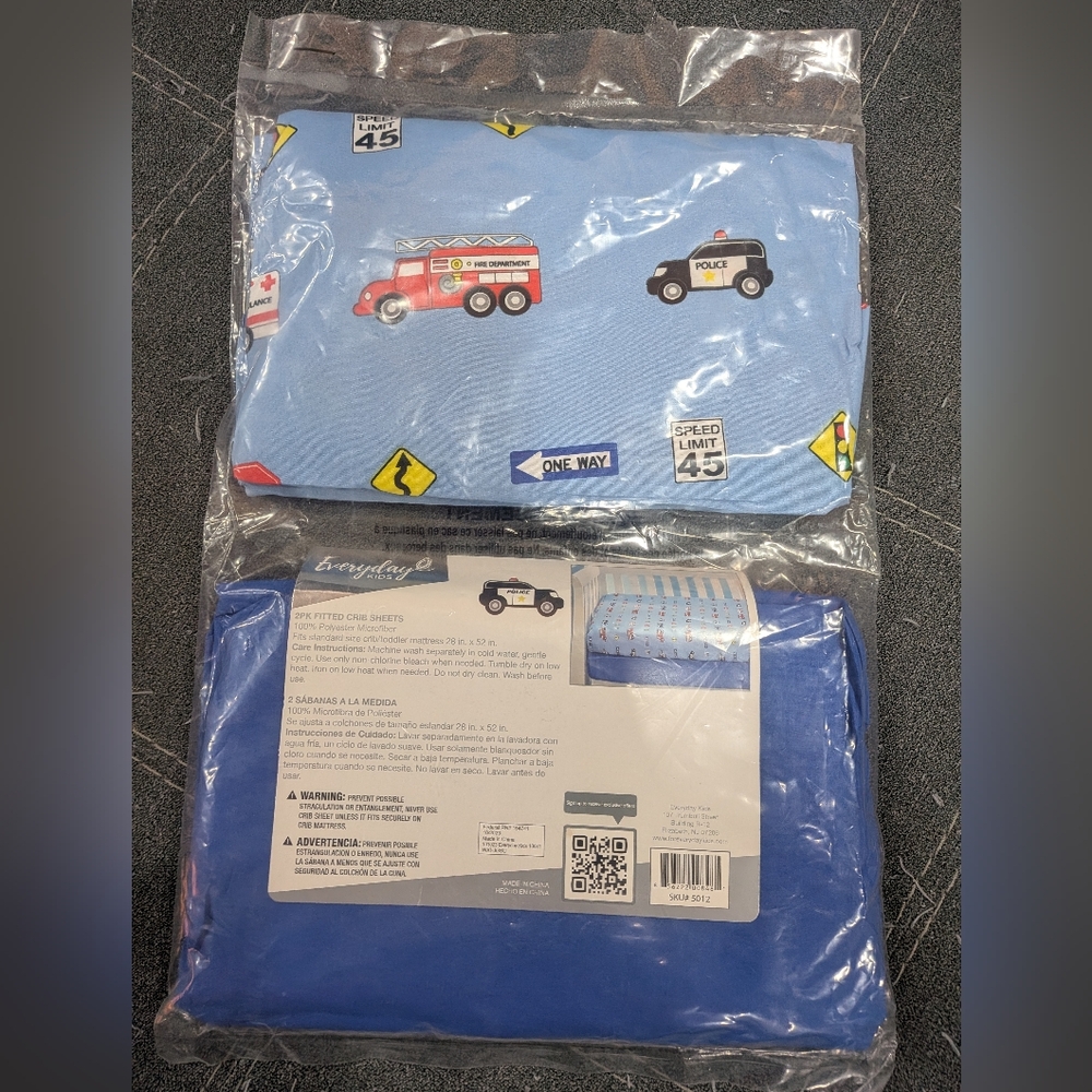 Two Brand New Crib Sheets Blue and Vehicle Print